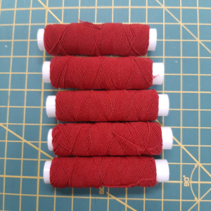 Rimpelelastiek rood, per 5 klosjes van 15 meter
