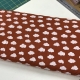 Poplin katoen brique met wolkjes €7,00 pm